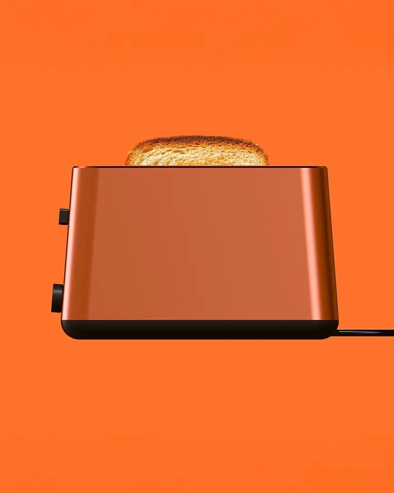Moderner oranger Toaster als Design-Objekt in der Küche – Symbiose aus Funktionalität und Ästhetik im Produktdesign.